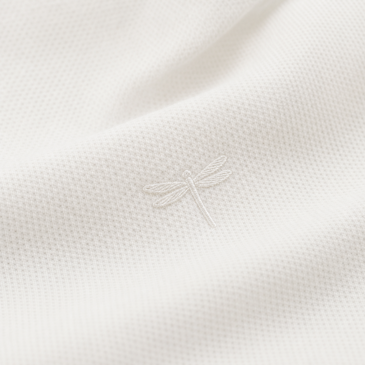 Sample close-up of tone-on-tone dragonfly embroidery