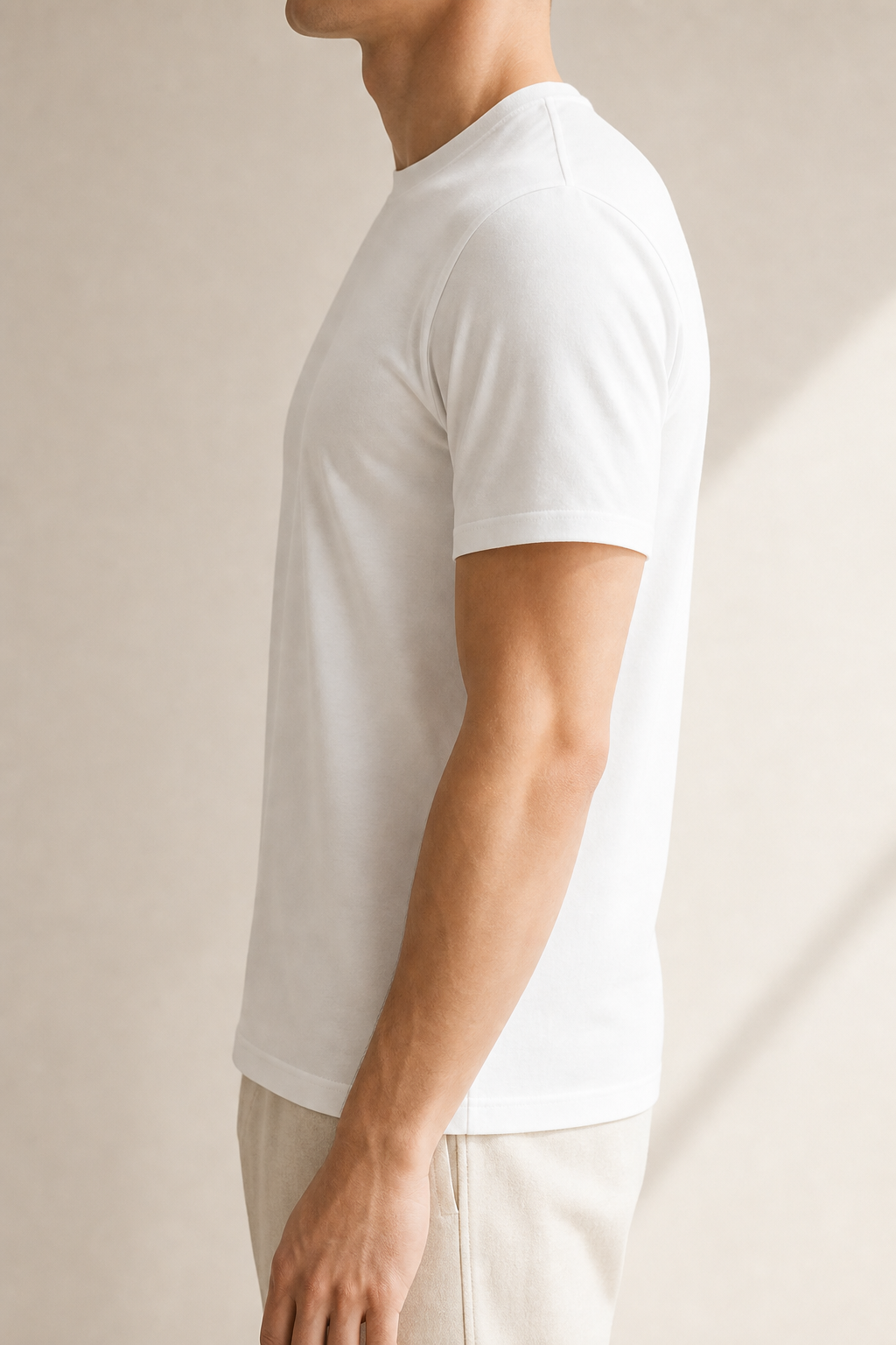 Side profile fit of a white organic cotton regulation tee